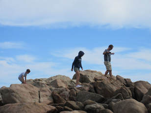 Kids playing on the rocks
